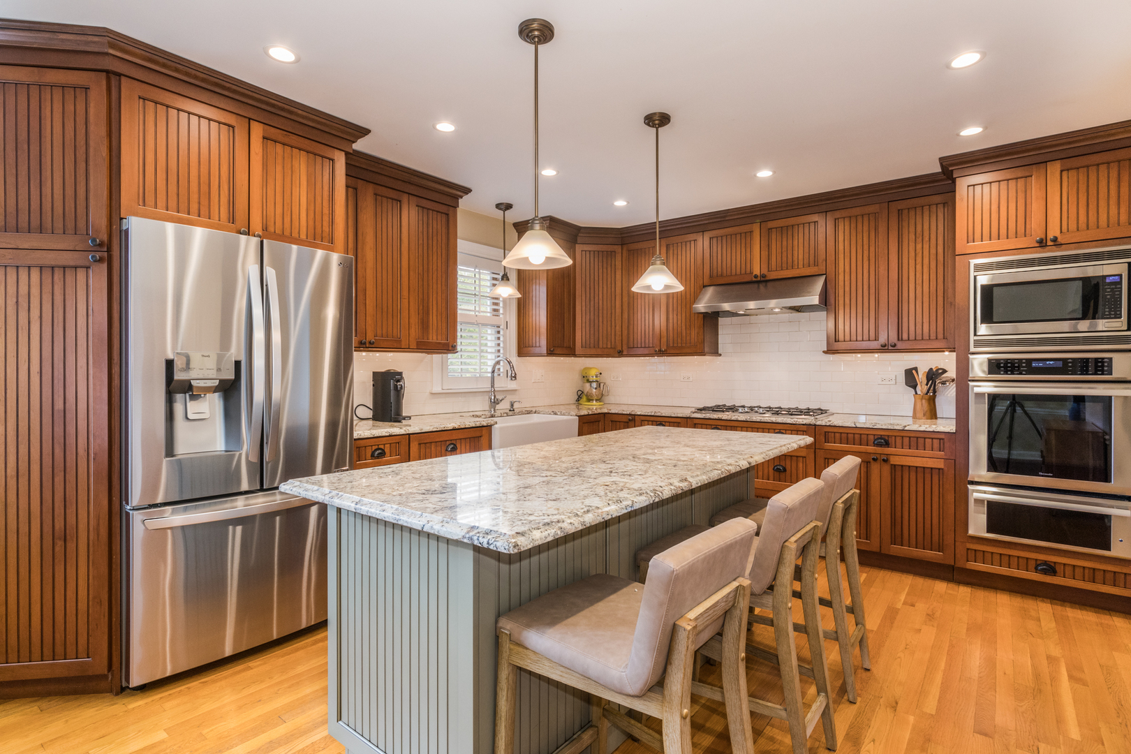 1116 South Aldine Avenue Park Ridge, IL 60068 - Photo 3 of 31 a kitchen with stainless steel appliances granite countertop a refrigerator a sink and a stove