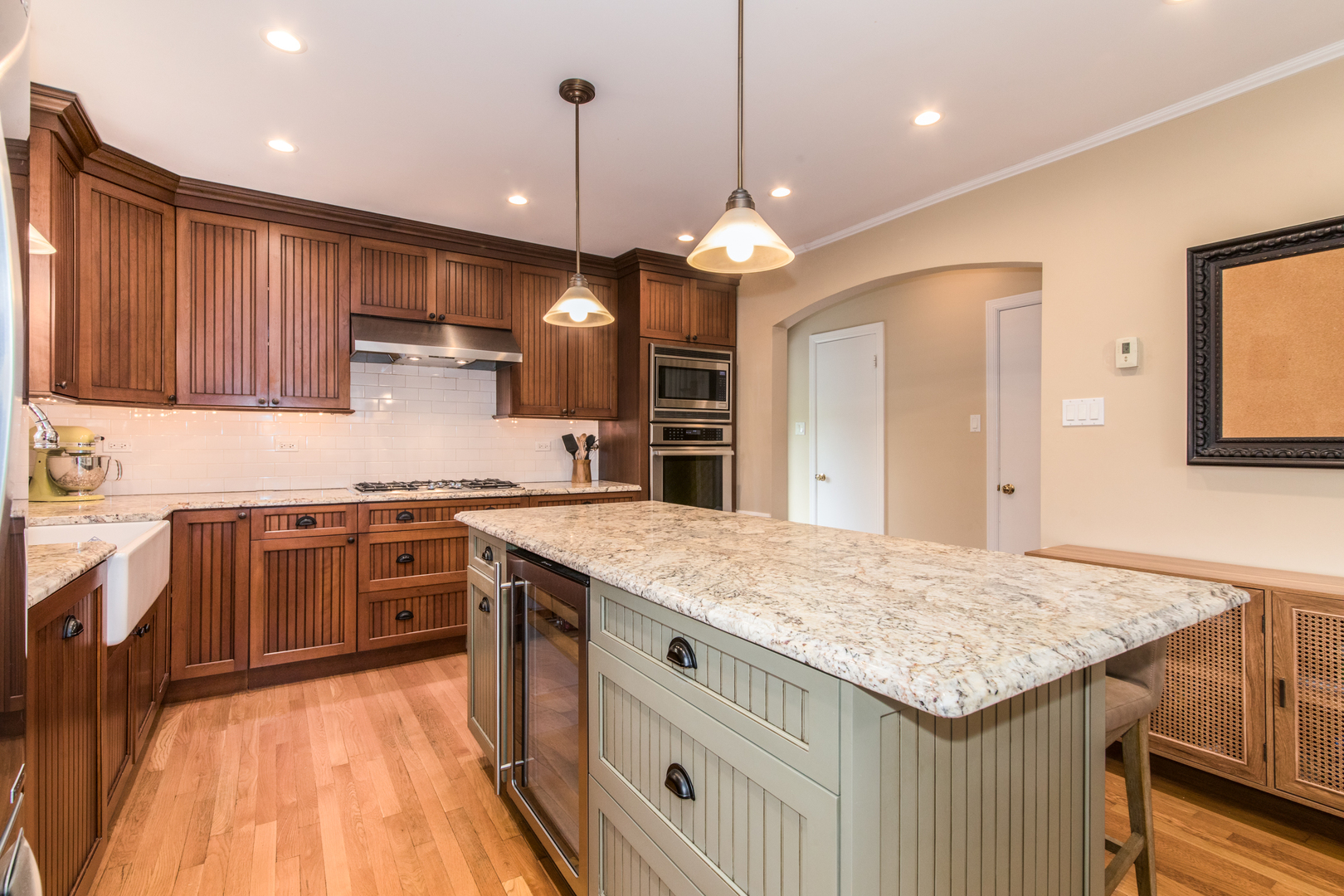 1116 South Aldine Avenue Park Ridge, IL 60068 - Photo 4 of 31 a kitchen with a stove kitchen island and stainless steel appliances