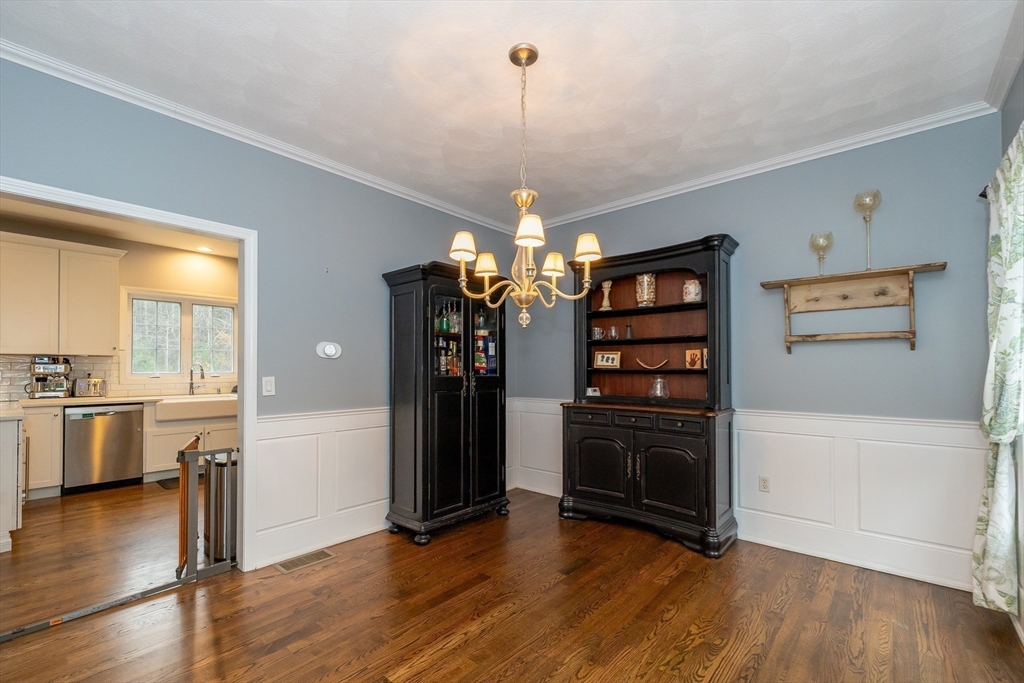 142 River Road Pepperell, MA 01463 - Photo 16 of 41 a view of a kitchen with refrigerator and wooden floor