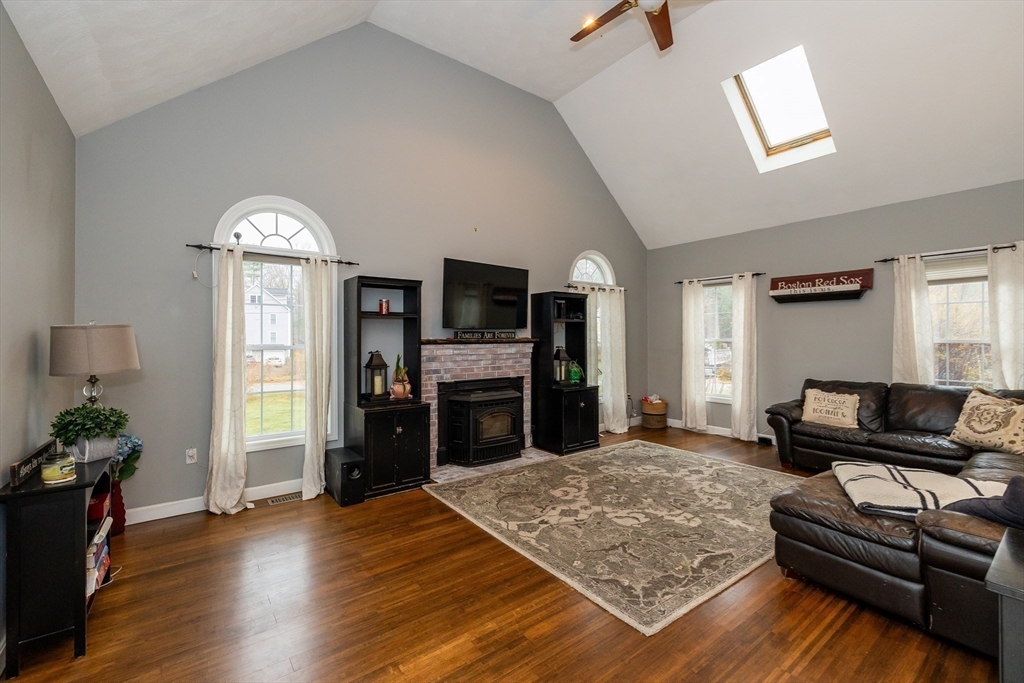 142 River Road Pepperell, MA 01463 - Photo 19 of 41 a living room with furniture and a flat screen tv