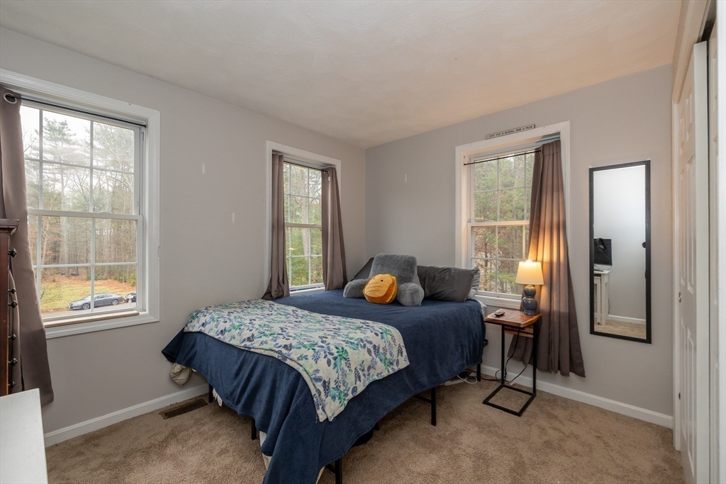 142 River Road Pepperell, MA 01463 - Photo 29 of 41 a bedroom with a bed and a window