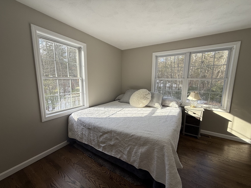 142 River Road Pepperell, MA 01463 - Photo 30 of 41 a bedroom with a bed and a large window