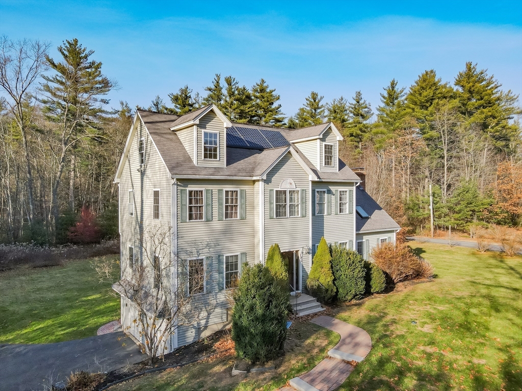 142 River Road Pepperell, MA 01463 - Photo 3 of 41 a front view of a house with a yard