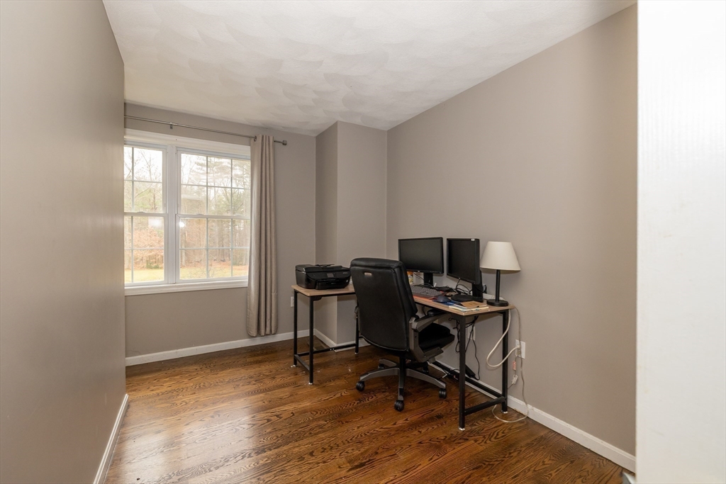 142 River Road Pepperell, MA 01463 - Photo 31 of 41 a view of a workspace with furniture and a window