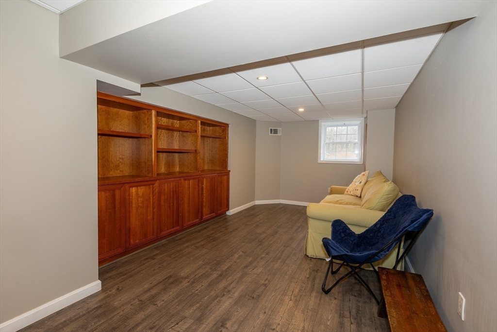 142 River Road Pepperell, MA 01463 - Photo 37 of 41 a living room with furniture and a chair