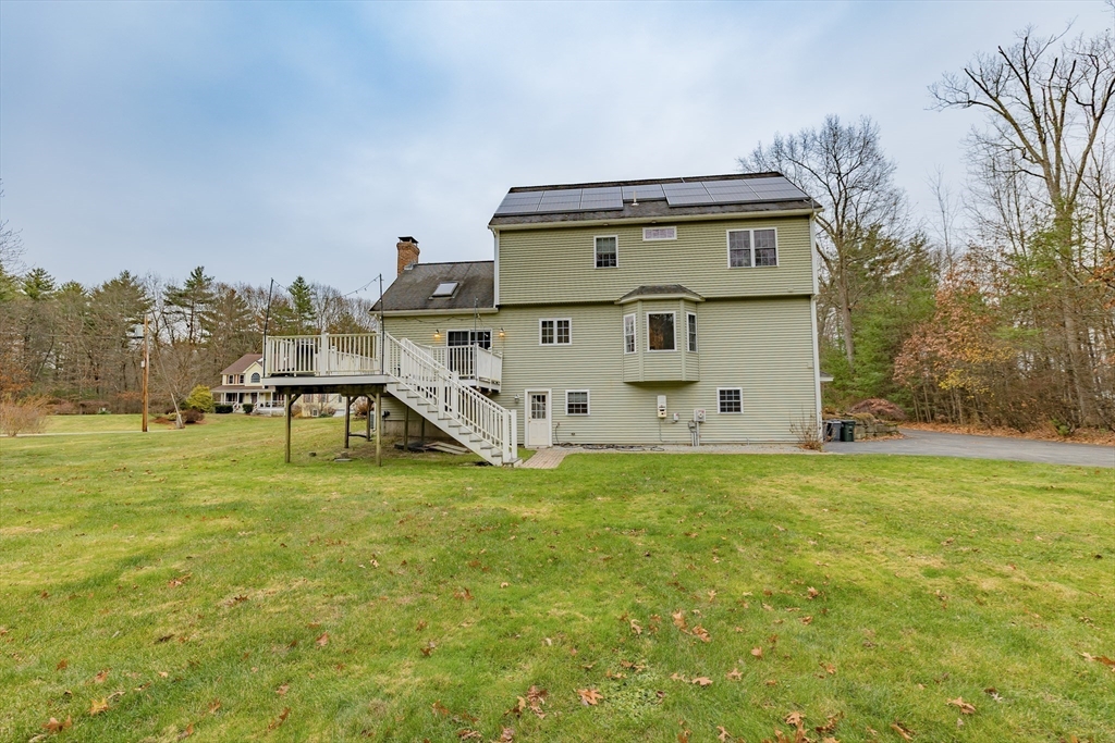 142 River Road Pepperell, MA 01463 - Photo 5 of 41 a front view of house with yard
