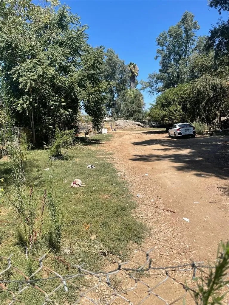 21580 Lane Perris Ca Perris, CA 92570 - Photo 3 of 5 a view of road and trees