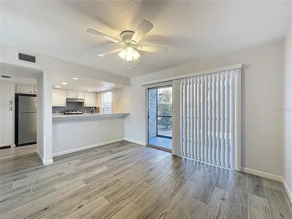 a kitchen with a sink stove and refrigerator