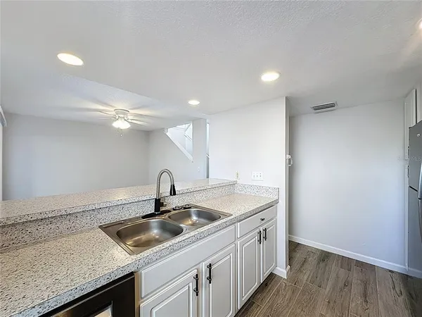 a kitchen with a stove and a refrigerator
