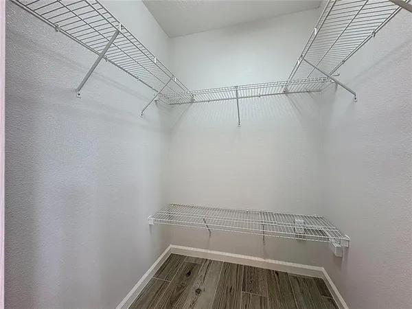 a view of a kitchen with a sink and a window