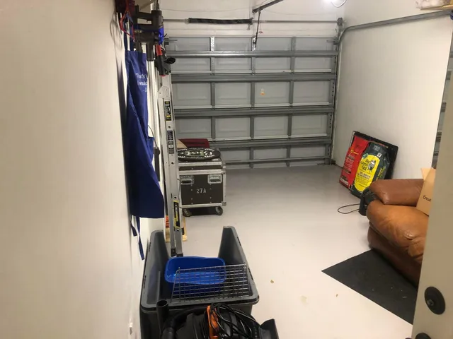 a living room with furniture a lamp and a chandelier