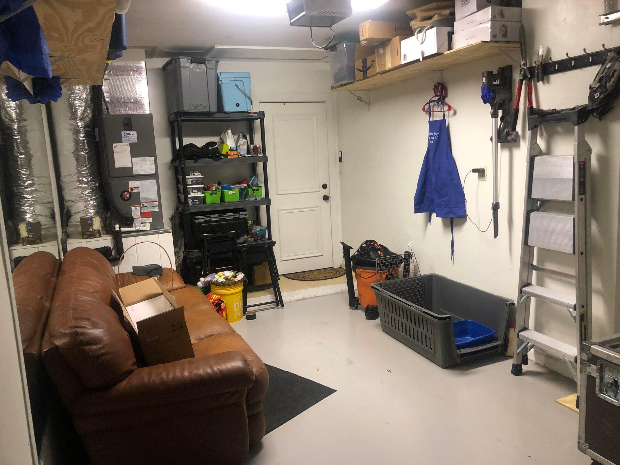 6797 Northeast 7th Avenue Boca Raton, FL 33487 - Photo 16 of 21 a living room with furniture a lamp and a chandelier