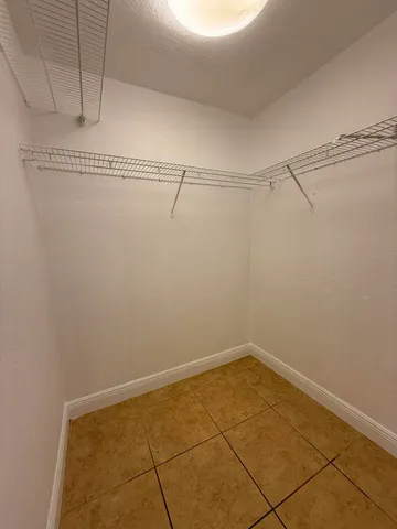 a view of a room with racks on the wall