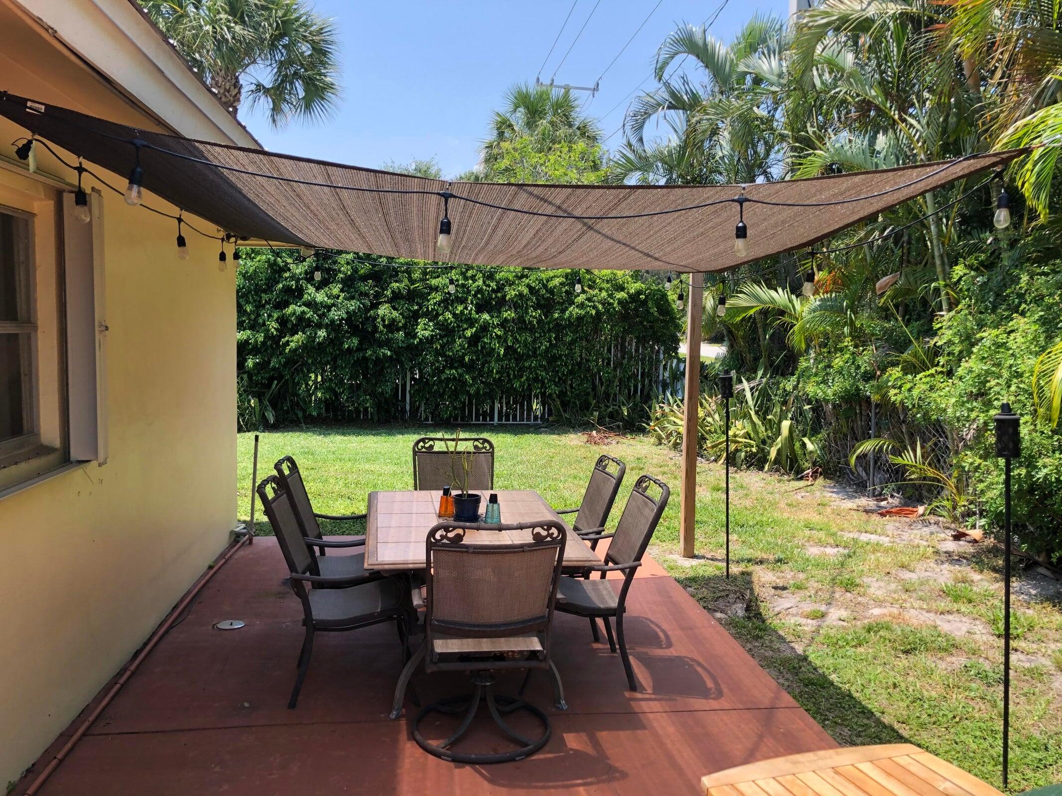 6797 Northeast 7th Avenue Boca Raton, FL 33487 - Photo 17 of 21 a view of an outdoor sitting area with a backyard