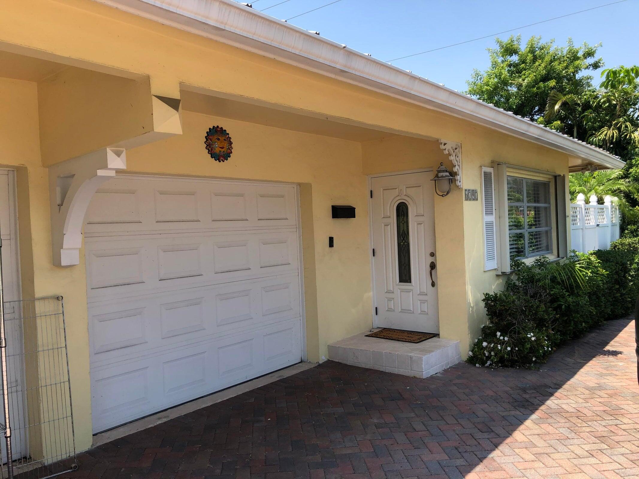 6797 Northeast 7th Avenue Boca Raton, FL 33487 - Photo 2 of 21 a view of a front door of the house