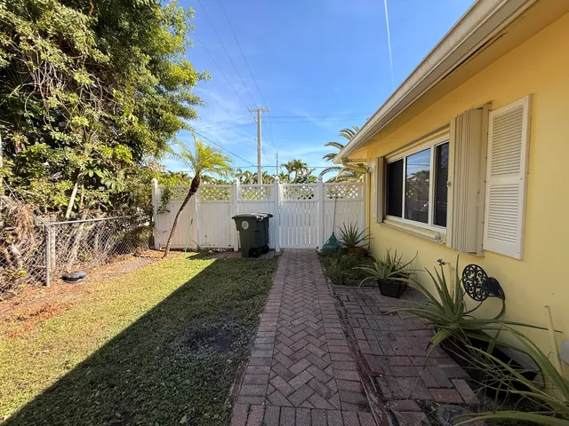 a front view of a house with trees