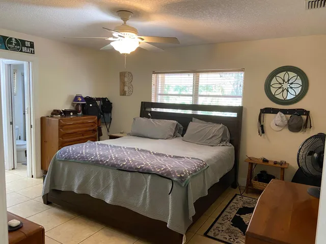 a bathroom with a sink vanity and a mirror