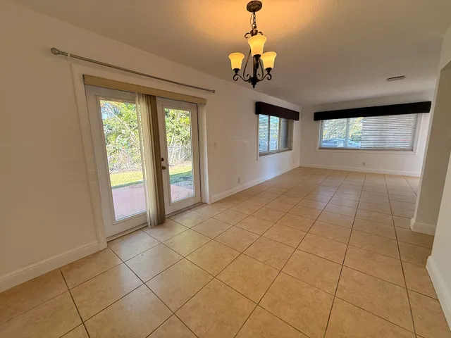 a view of hallway with window and stairs