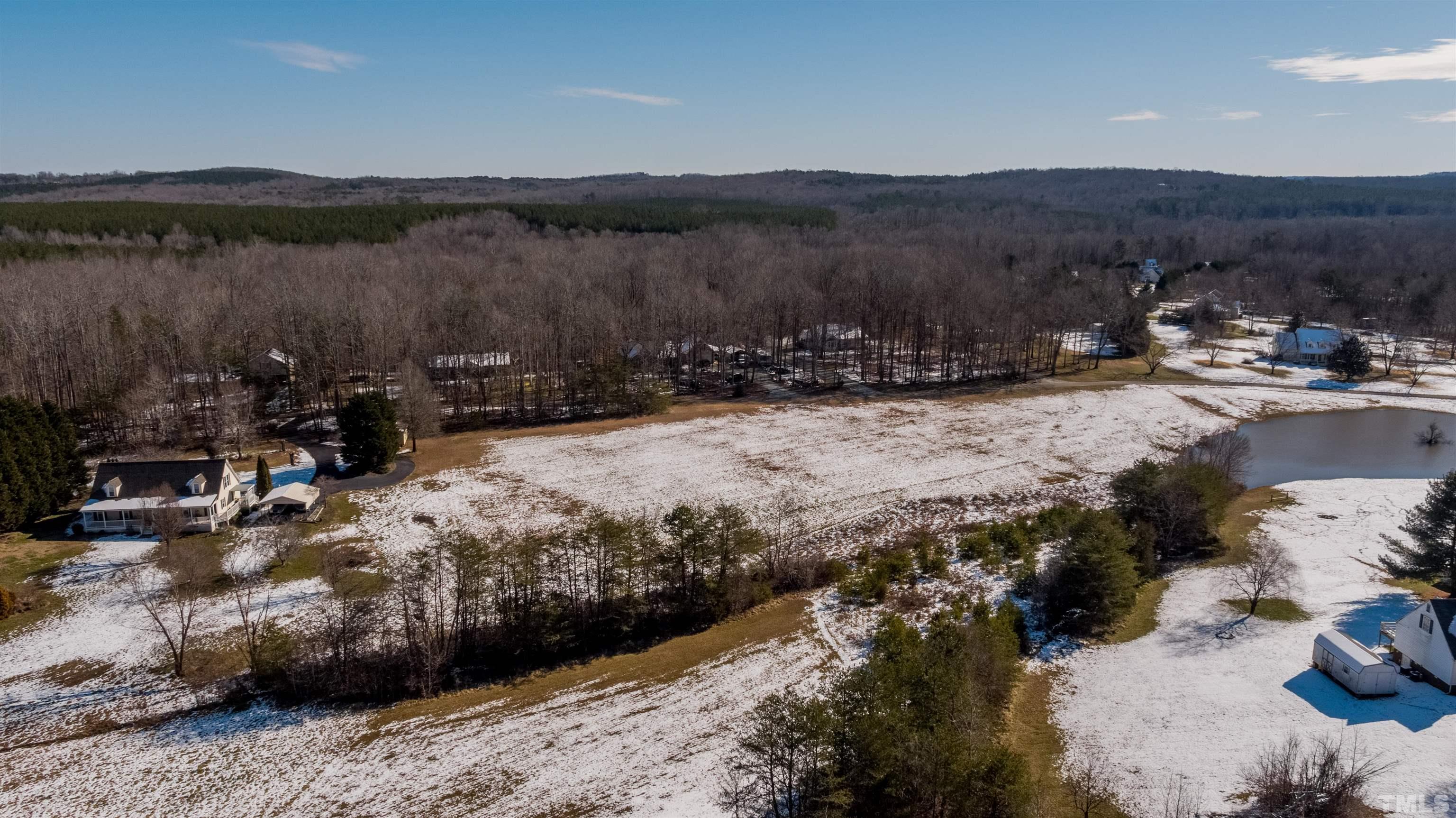 7-8 Stoney Mountain Road Rougemont, NC 27572 - Photo 21 of 31 a view of a lake with a mountain