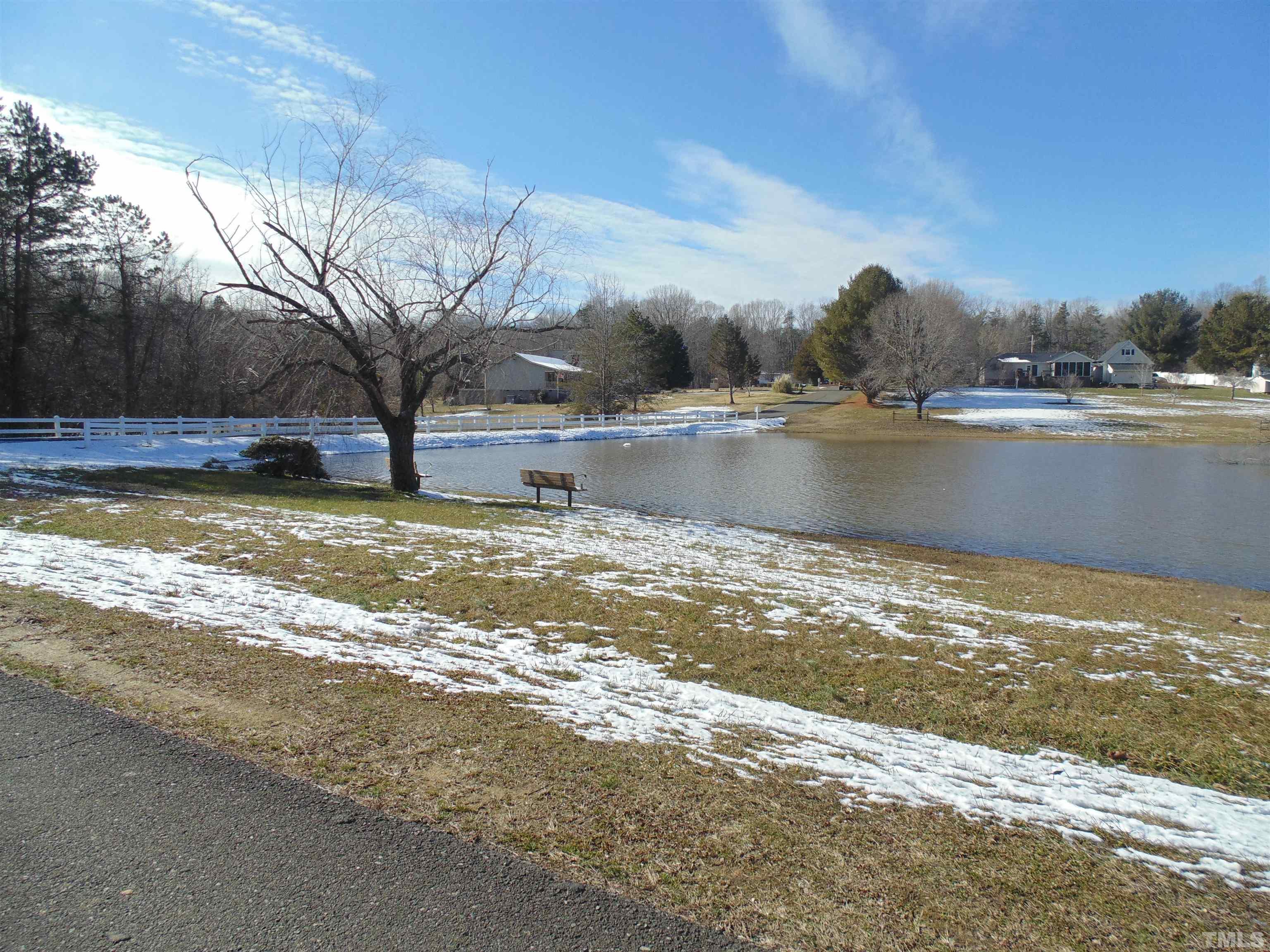 7-8 Stoney Mountain Road Rougemont, NC 27572 - Photo 4 of 31 a view of a lake with houses in the back