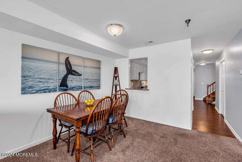 135 1st Street, Unit 2F Keyport, NJ 07735 - Photo 15 of 46 a dining room with furniture and wooden floor