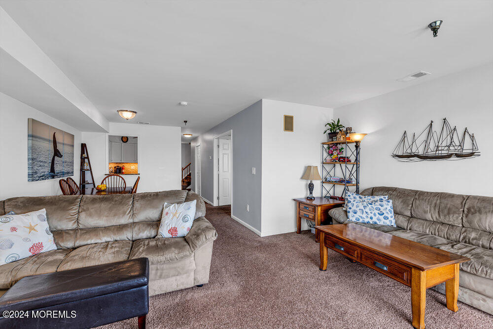 135 1st Street, Unit 2F Keyport, NJ 07735 - Photo 18 of 46 a living room with furniture and a couch