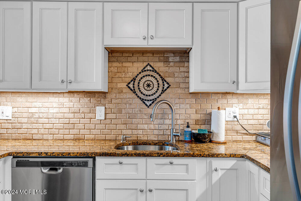 135 1st Street, Unit 2F Keyport, NJ 07735 - Photo 20 of 46 a kitchen with granite countertop a sink and cabinets