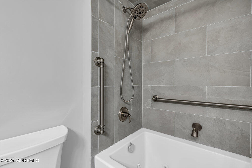 135 1st Street, Unit 2F Keyport, NJ 07735 - Photo 28 of 46 a bathroom with a tub and toilet