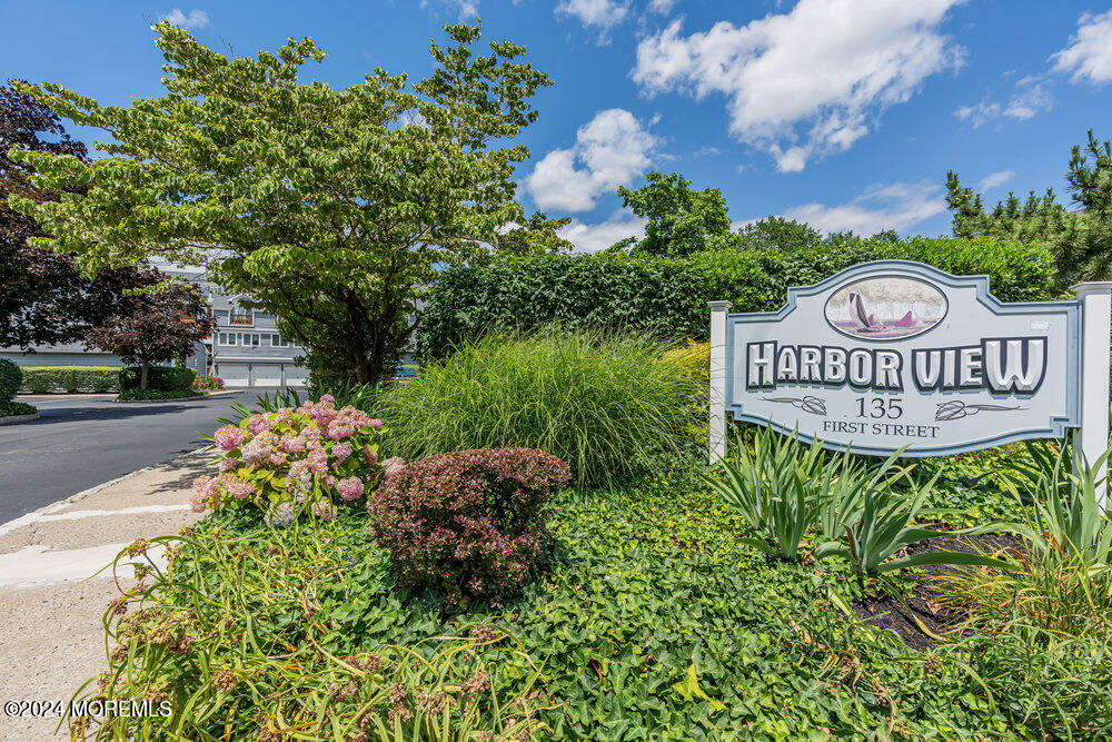 135 1st Street, Unit 2F Keyport, NJ 07735 - Photo 3 of 46 a view of sign board with flower plants