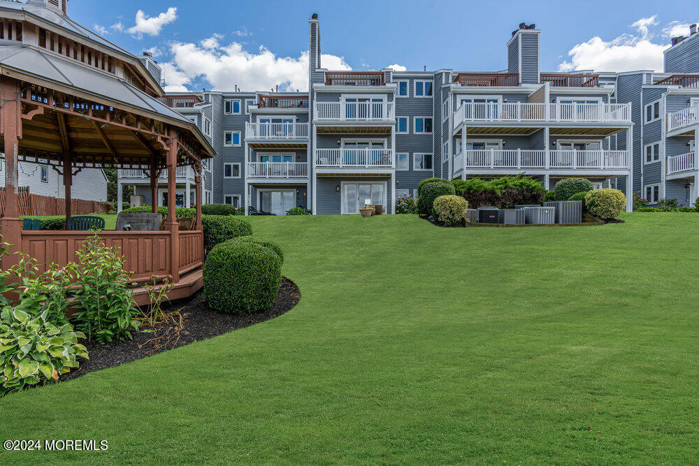 135 1st Street, Unit 2F Keyport, NJ 07735 - Photo 39 of 46 a view of a building with a garden