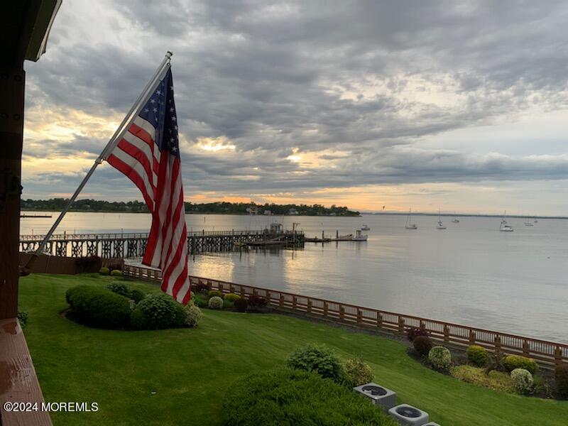 135 1st Street, Unit 2F Keyport, NJ 07735 - Photo 45 of 46 a view of a lake and a yard