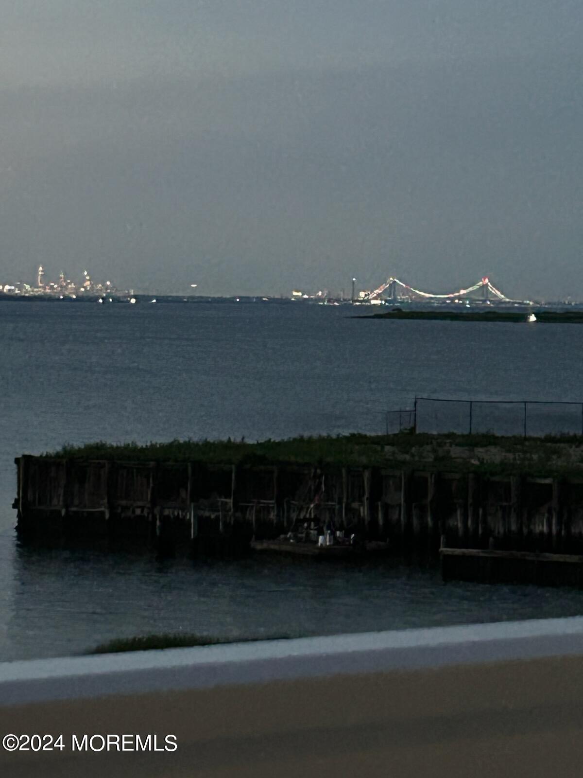 135 1st Street, Unit 2F Keyport, NJ 07735 - Photo 46 of 46 a terrace with a bench