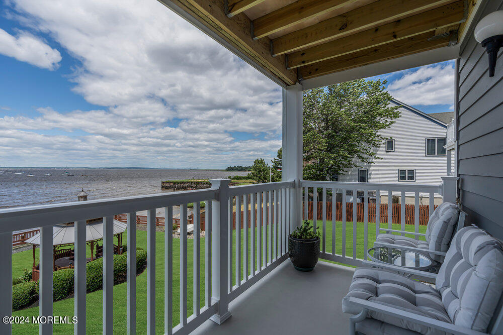 135 1st Street, Unit 2F Keyport, NJ 07735 - Photo 6 of 46 a balcony with furniture