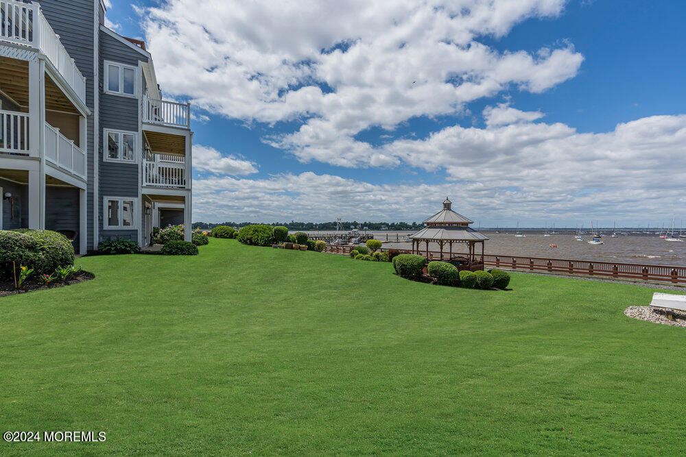 135 1st Street, Unit 2F Keyport, NJ 07735 - Photo 9 of 46 a view of a garden with houses