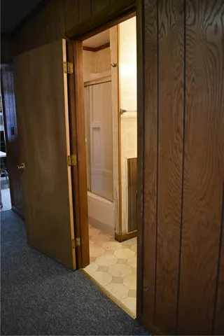 an empty room with wooden door