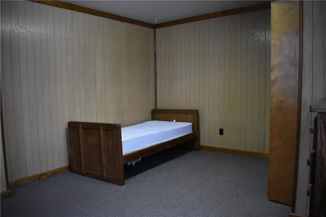 a room with a bed and a window