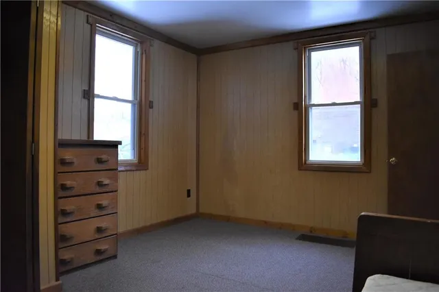a room with window and cabinet