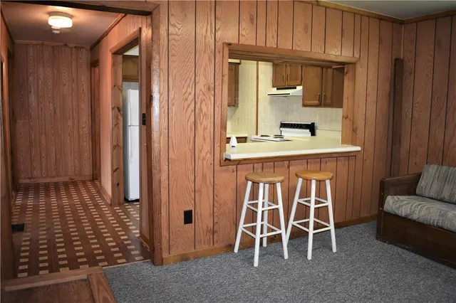 a kitchen with a sink a stove and cabinets