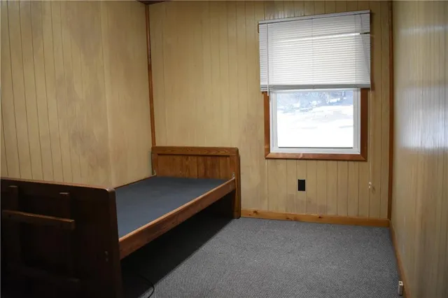 a view of room with window and wooden floor