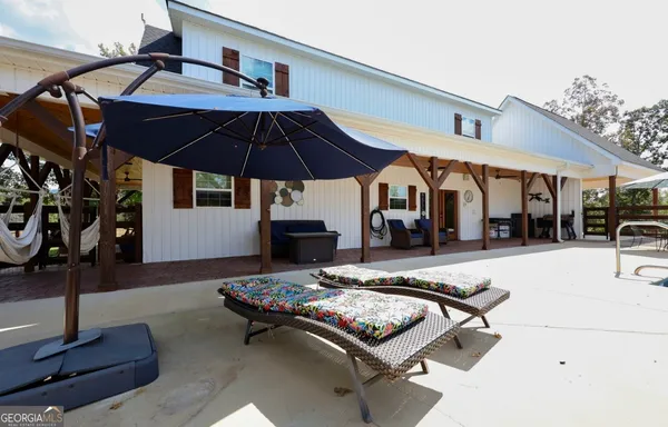 a outdoor space with furniture and umbrella