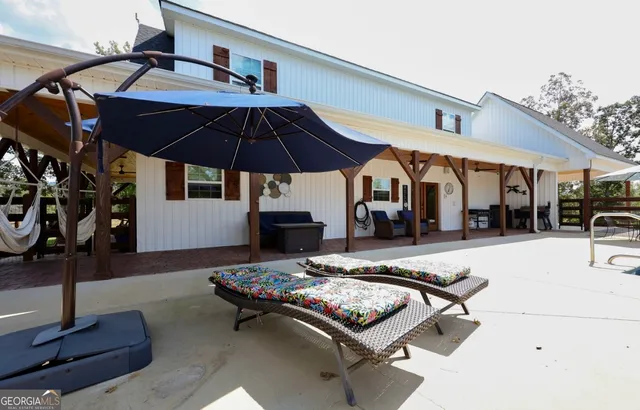 a outdoor space with furniture and umbrella