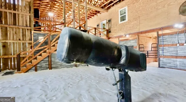 a view of a workspace with furniture and wooden floor