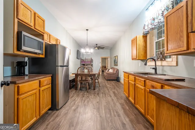 a view of a balcony with furniture and large windows