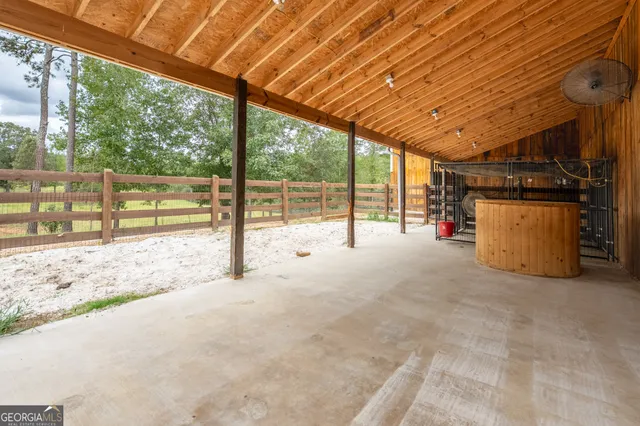 a view of a swimming pool with a yard