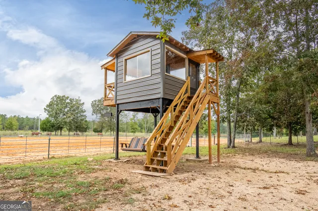 swimming pool view with a outdoor seating