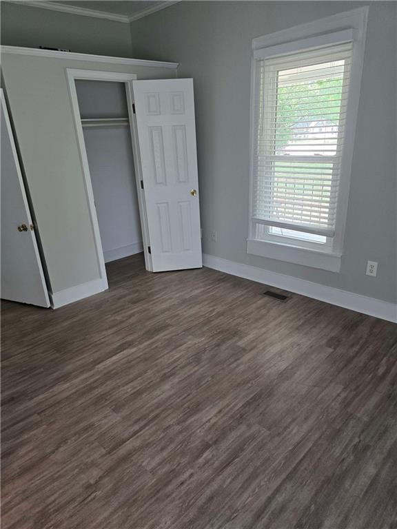 2863 Maysville Road Commerce, GA 30529 - Photo 10 of 15 a view of an empty room with wooden floor and a window