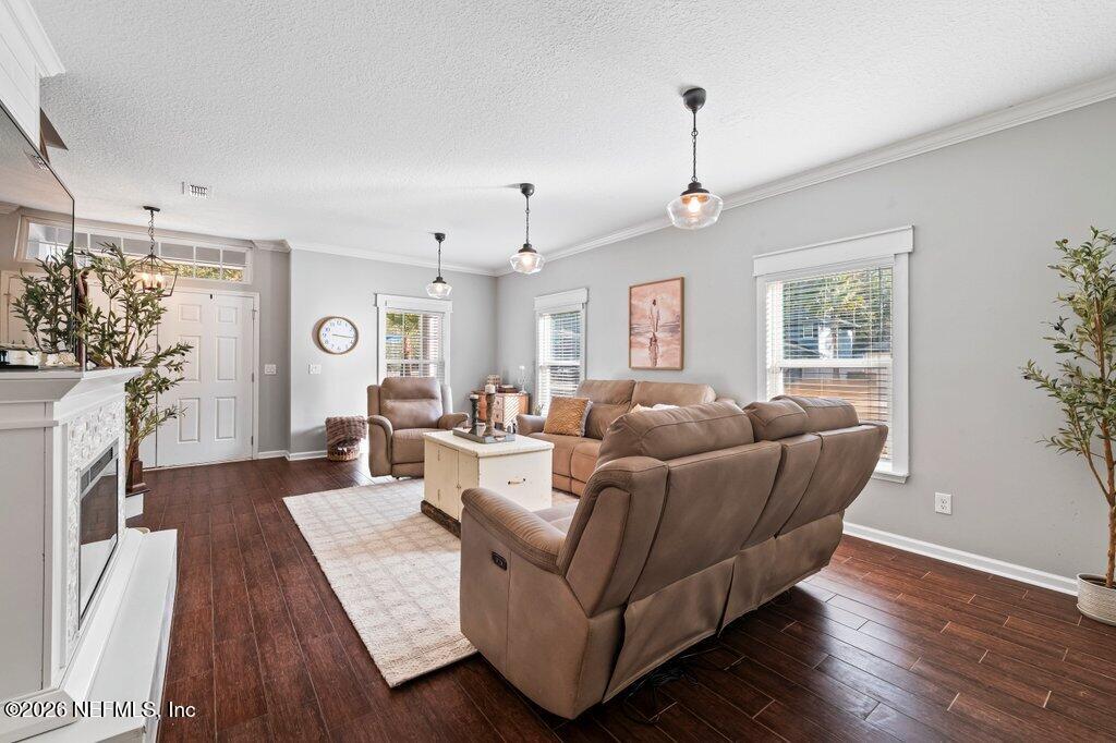 81015 Lockhaven Drive Yulee, FL 32097 - Photo 11 of 55 a living room with furniture a wooden floor and a window
