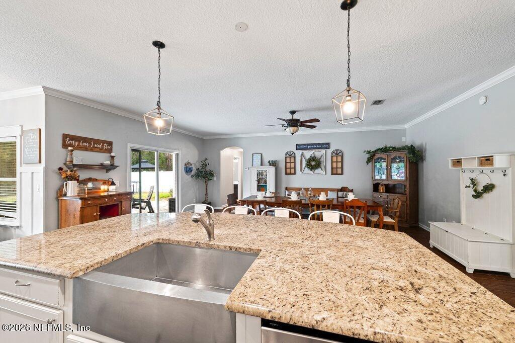 81015 Lockhaven Drive Yulee, FL 32097 - Photo 16 of 55 a view of a living room and kitchen