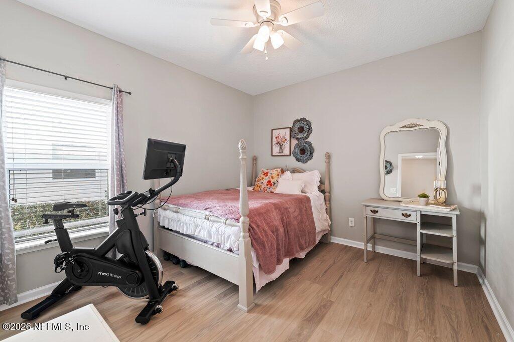 81015 Lockhaven Drive Yulee, FL 32097 - Photo 24 of 55 a bedroom with a bed and a desk