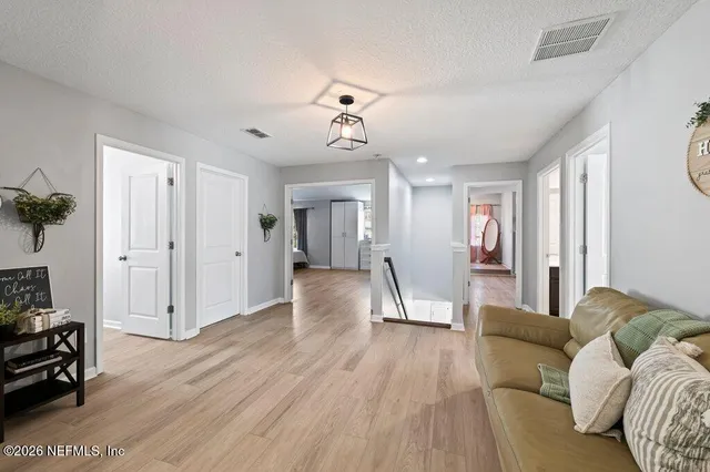 a view of a livingroom with furniture and wooden floor